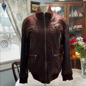 Men's Burgundy Leather Jacket with Zipper Accents. Detachable lining